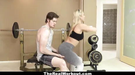 He puts his hands on the ass of the gym trainer.