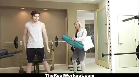 He puts his hands on the ass of the gym trainer.