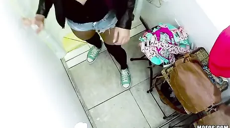 The customer stands naked in front of the clerk