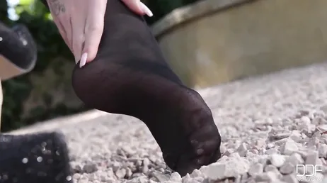 The good weather is coming and this slut is jerking off in the garden at home.