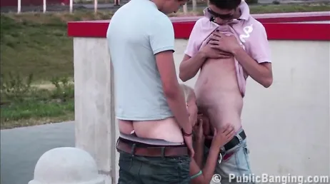 A very hot amateur recorded a threesome in the middle of the street